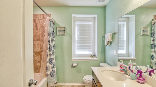 full bathroom featuring vanity, toilet, and shower / tub combo with curtain