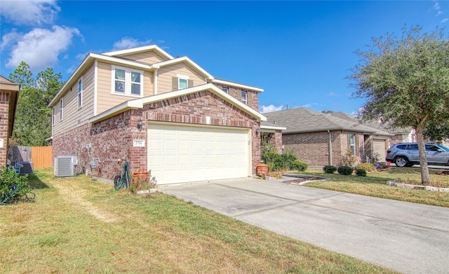 view of front of home with central air condition unit, a front lawn, and a garage