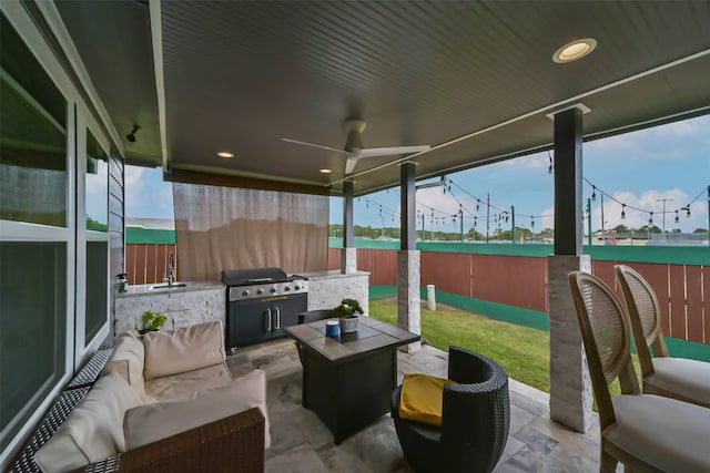 view of patio / terrace featuring a grill, ceiling fan, sink, and an outdoor living space