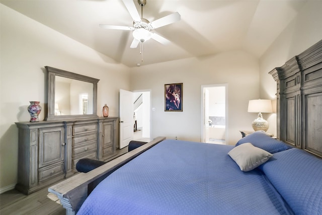 bedroom with connected bathroom, lofted ceiling, hardwood / wood-style floors, and ceiling fan