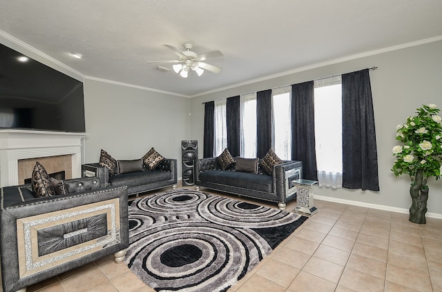 living room featuring ceiling fan, light tile patterned floors, and crown molding