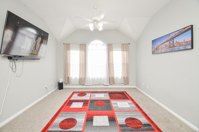 interior space featuring carpet, vaulted ceiling, and ceiling fan