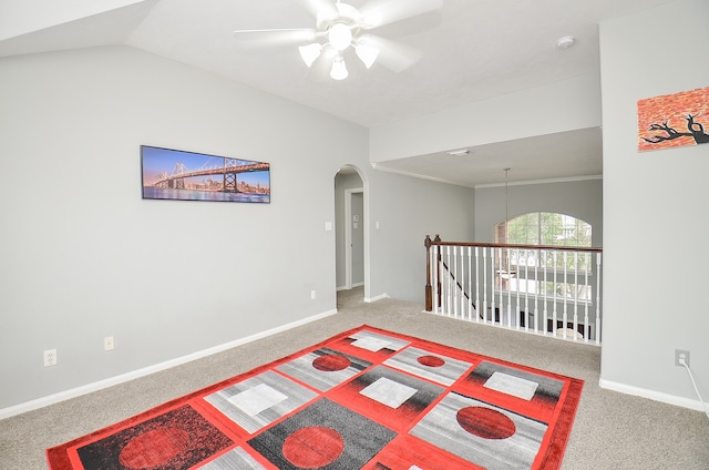 spare room with carpet flooring, ceiling fan, and vaulted ceiling