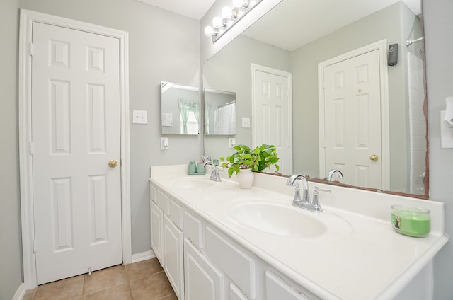 bathroom with vanity and tile patterned floors