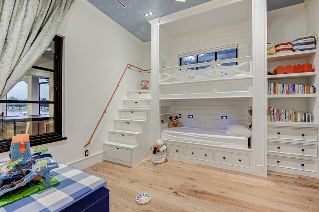 bedroom featuring crown molding and hardwood / wood-style floors