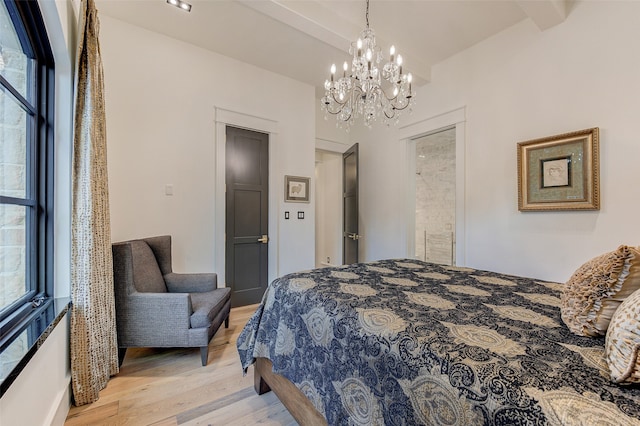 bedroom with light hardwood / wood-style floors, multiple windows, beam ceiling, and a notable chandelier