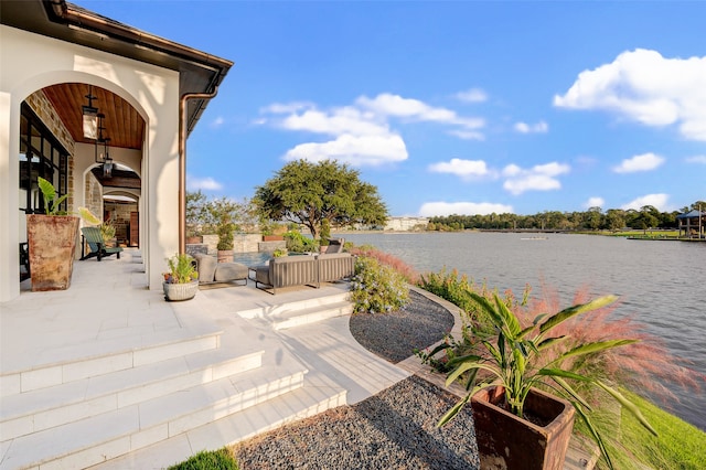 view of patio with a water view