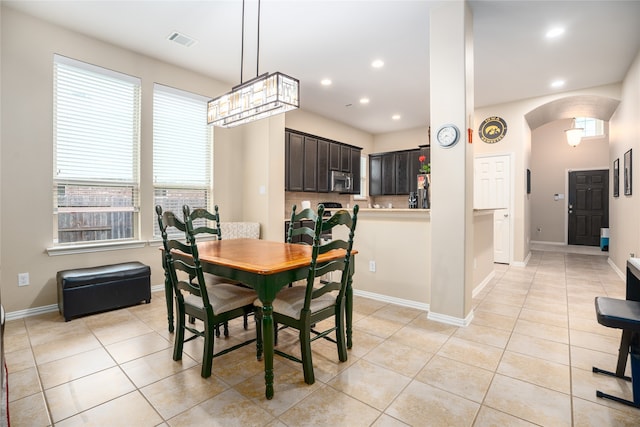 dining space featuring light tile patterned flooring