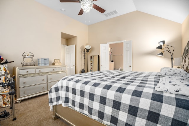 bedroom with lofted ceiling, ensuite bathroom, carpet flooring, and ceiling fan