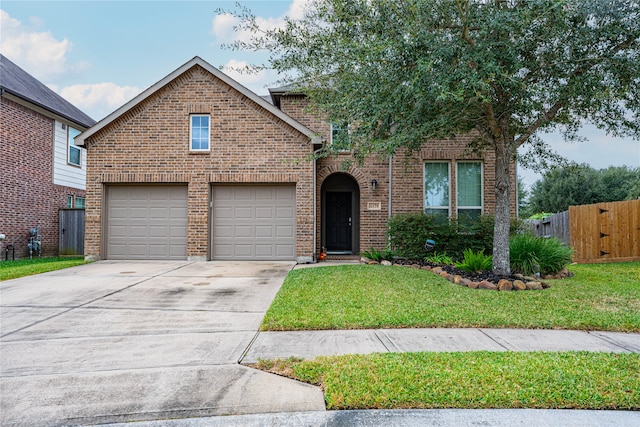 view of front property with a front yard and a garage