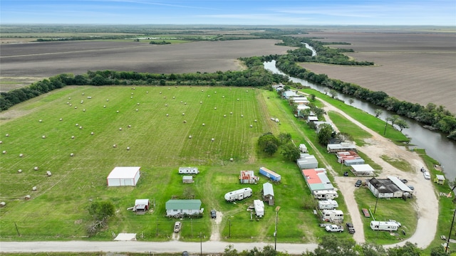 birds eye view of property featuring a rural view and a water view