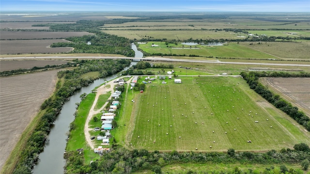 drone / aerial view with a water view and a rural view