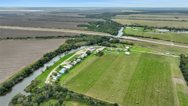 drone / aerial view with a water view and a rural view