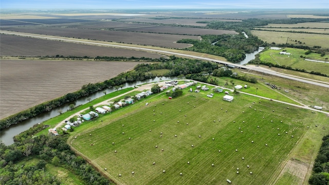 bird's eye view with a water view and a rural view