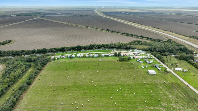 aerial view with a rural view and a water view