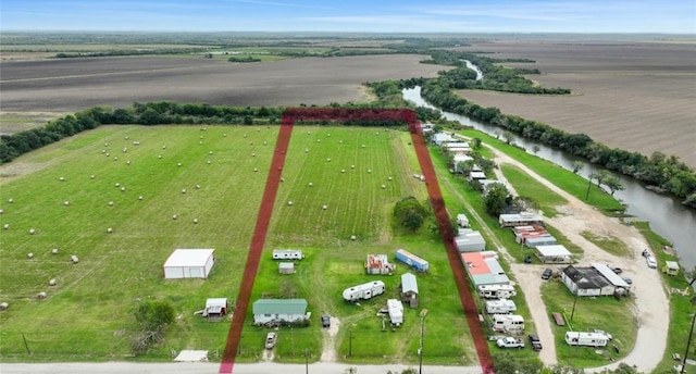 aerial view with a water view and a rural view