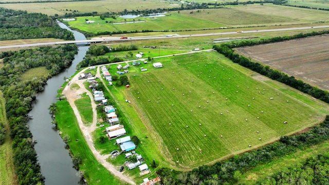 drone / aerial view featuring a rural view and a water view