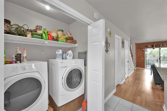 laundry area featuring light tile patterned flooring and independent washer and dryer