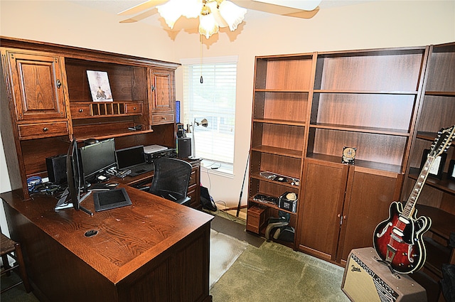 home office featuring dark carpet and ceiling fan