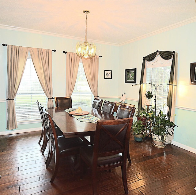dining room featuring dark wood-style flooring, a notable chandelier, and a healthy amount of sunlight