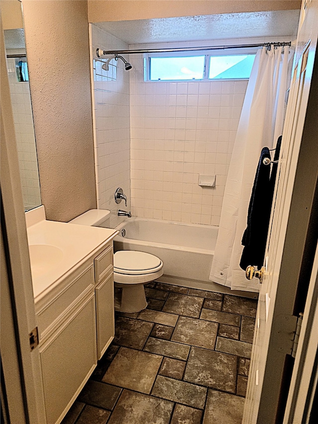 full bathroom with toilet, shower / tub combo, and vanity