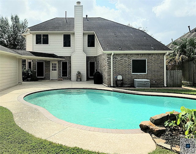 view of pool featuring a fenced in pool, fence, a patio, and central AC unit