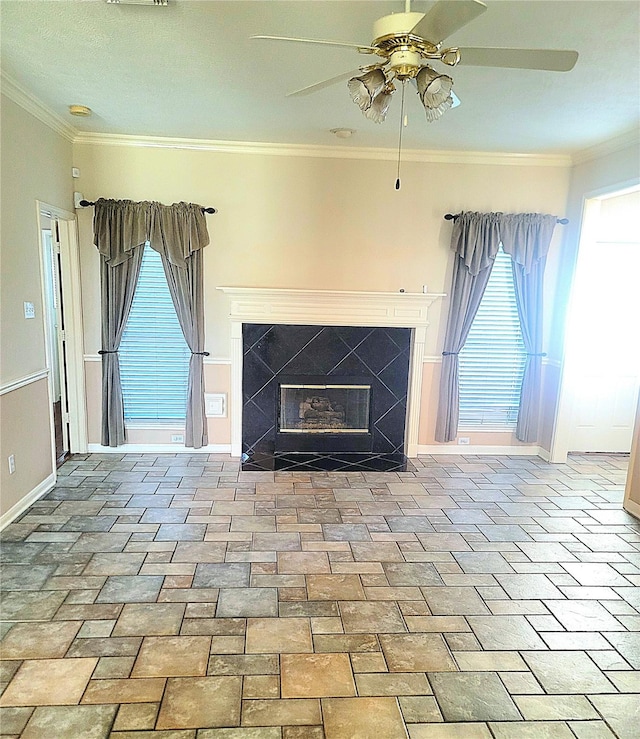 interior details with baseboards, a ceiling fan, a high end fireplace, and ornamental molding