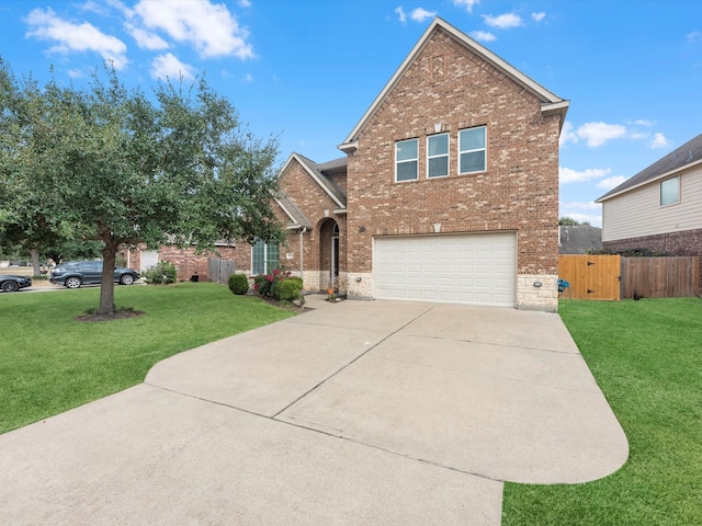 view of property with a front yard and a garage