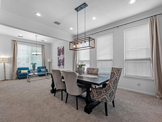 dining room with crown molding, carpet floors, and a wealth of natural light