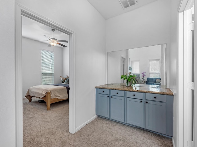 bathroom featuring vanity, ceiling fan, and plenty of natural light