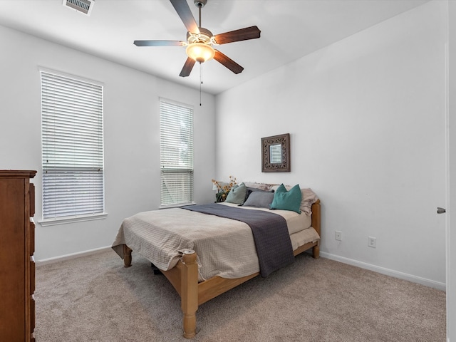 bedroom featuring light carpet and ceiling fan