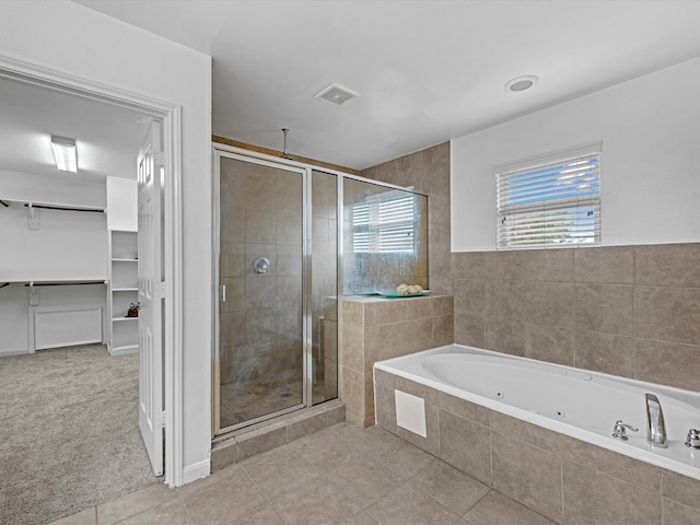 bathroom with plus walk in shower and tile patterned flooring