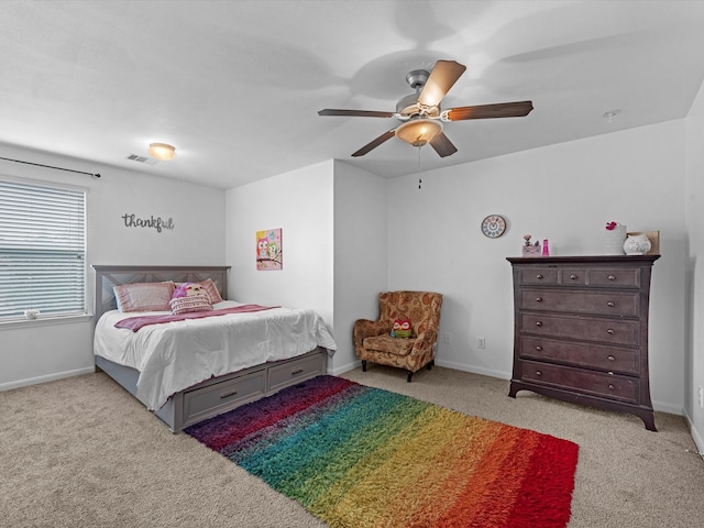 bedroom featuring light carpet and ceiling fan