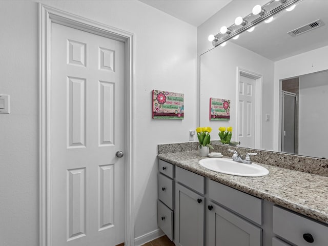 bathroom featuring vanity and walk in shower