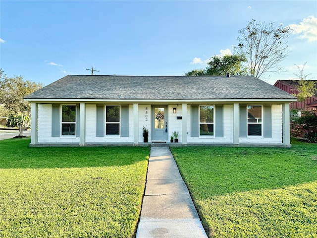 ranch-style house featuring a front lawn