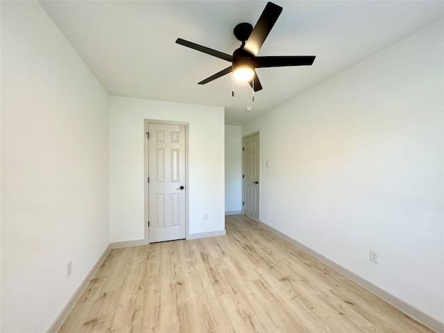 unfurnished bedroom with light wood-type flooring and ceiling fan