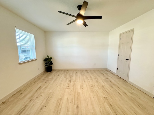 unfurnished room with ceiling fan and light hardwood / wood-style flooring