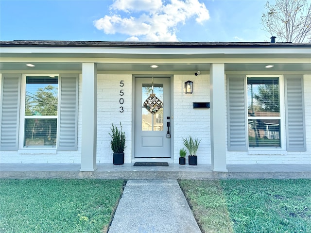 entrance to property with a porch