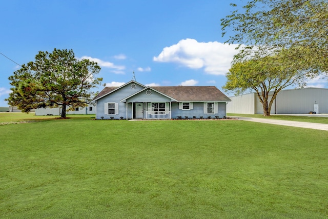 ranch-style home featuring a front yard and a porch