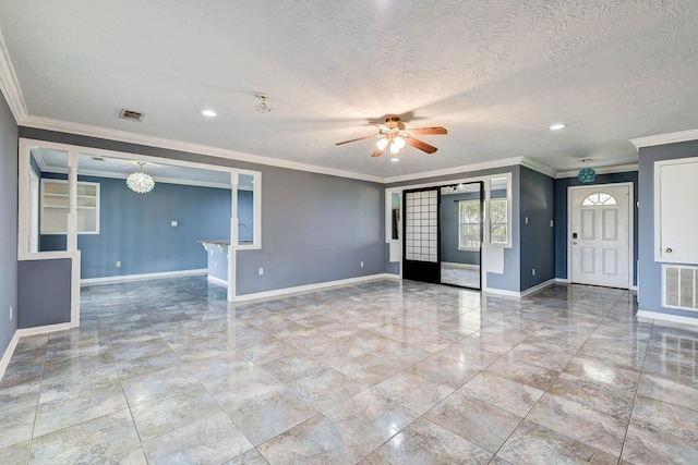 spare room featuring ceiling fan, ornamental molding, and a textured ceiling