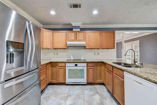 kitchen featuring sink, light stone countertops, light tile patterned flooring, crown molding, and white appliances