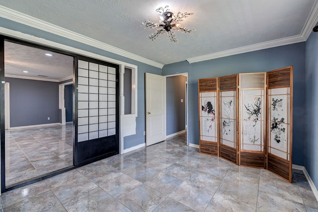 entryway featuring ornamental molding, french doors, a textured ceiling, and a notable chandelier