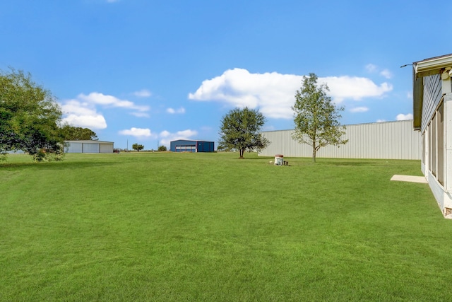 view of yard with an outdoor structure