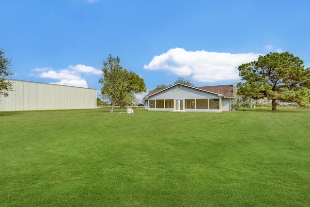 view of yard with a sunroom