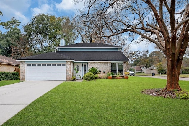 view of front of property with a front lawn and a garage