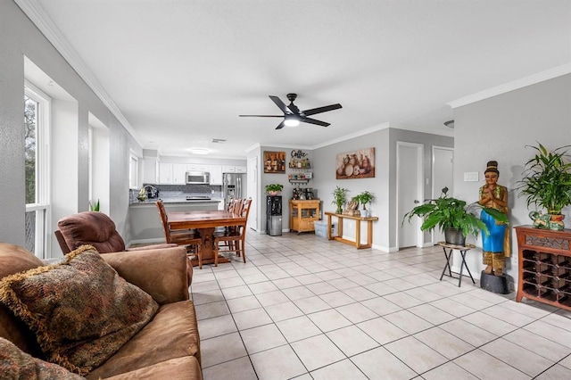 tiled living room featuring ceiling fan and crown molding