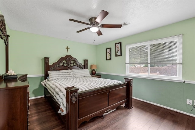 bedroom featuring dark hardwood / wood-style flooring and ceiling fan