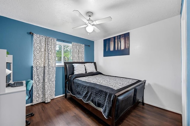 bedroom featuring ceiling fan, dark hardwood / wood-style flooring, and a textured ceiling