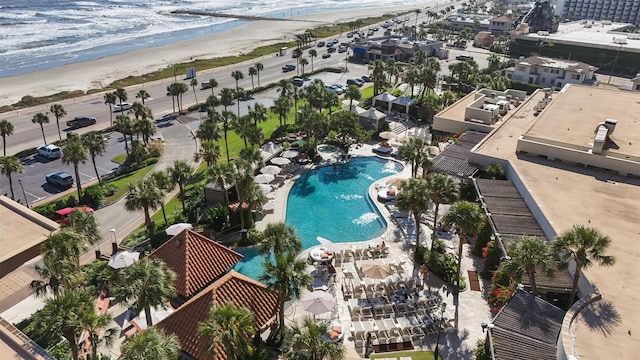 drone / aerial view with a water view and a view of the beach