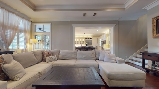 living room featuring crown molding and hardwood / wood-style floors